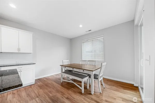 a room with wooden floor and a window