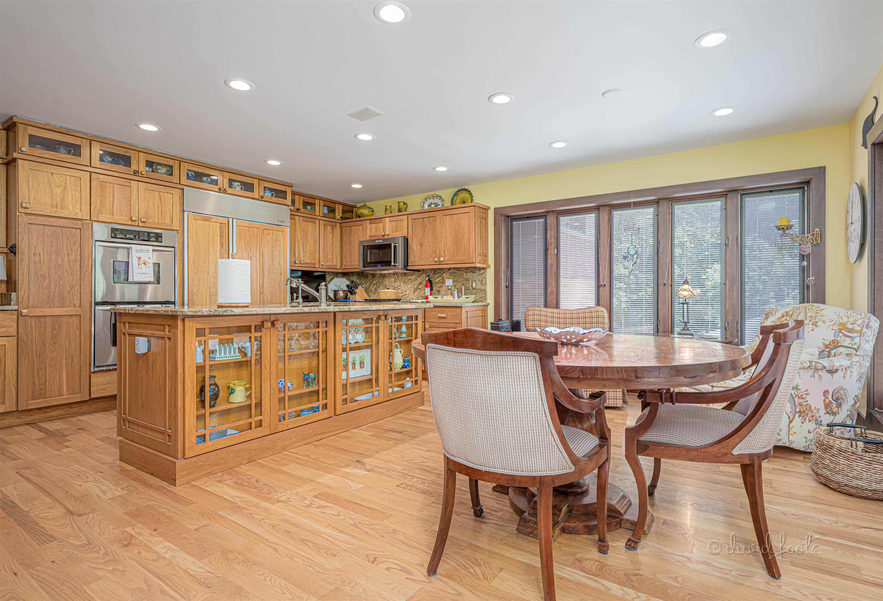 49 High Ridge Run Galena, IL 61036 - Photo 24 of 81 a view of a dining room with furniture a kitchen and chandelier