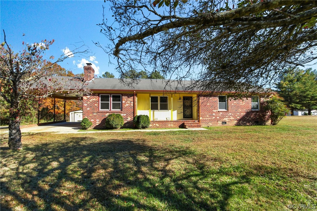 4807 Olgers Road Sutherland, VA 23885 - Photo 1 of 25 a front view of a house with a yard