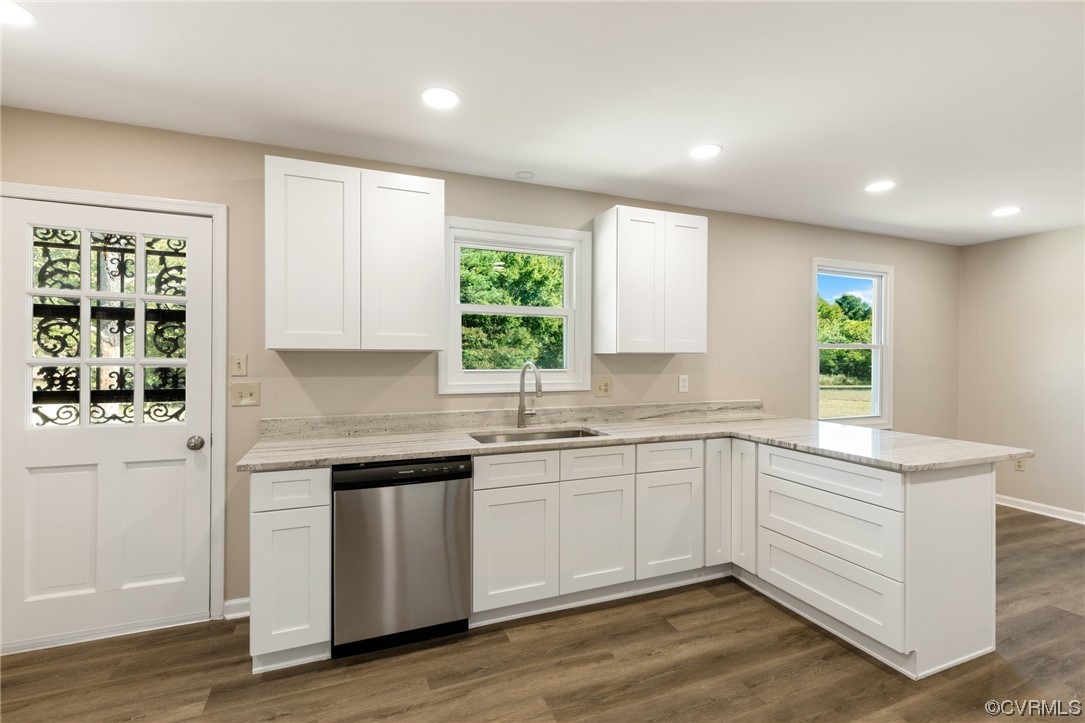 4807 Olgers Road Sutherland, VA 23885 - Photo 11 of 25 a kitchen with a sink cabinets wooden floor and a window