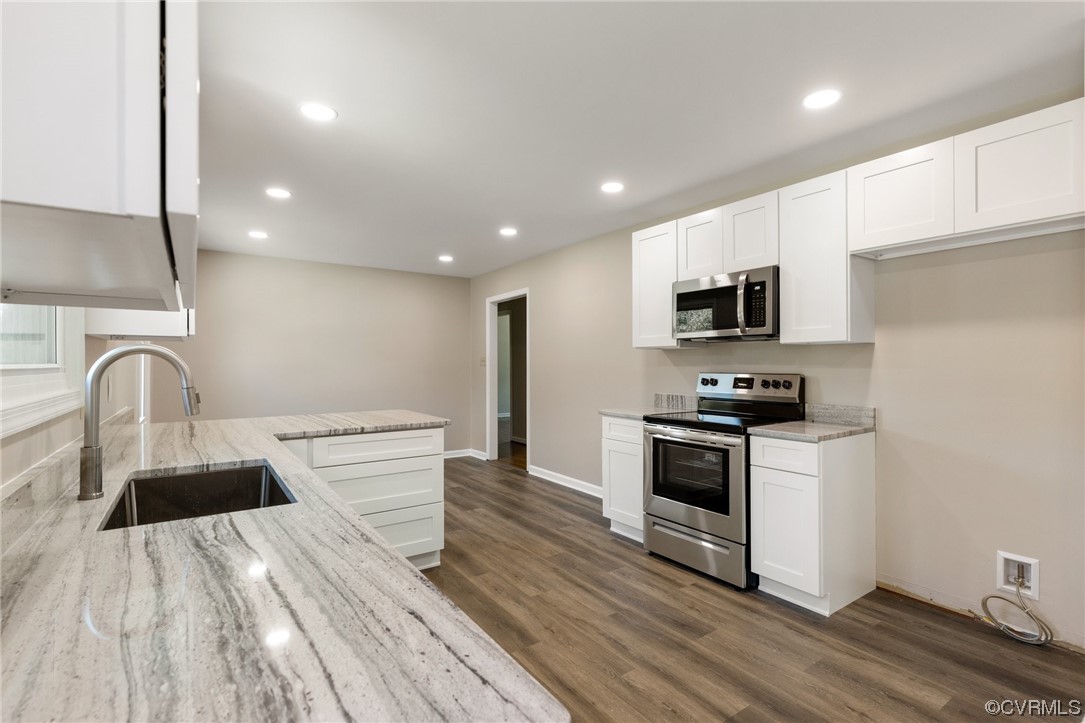 4807 Olgers Road Sutherland, VA 23885 - Photo 12 of 25 a kitchen with sink a microwave and cabinets