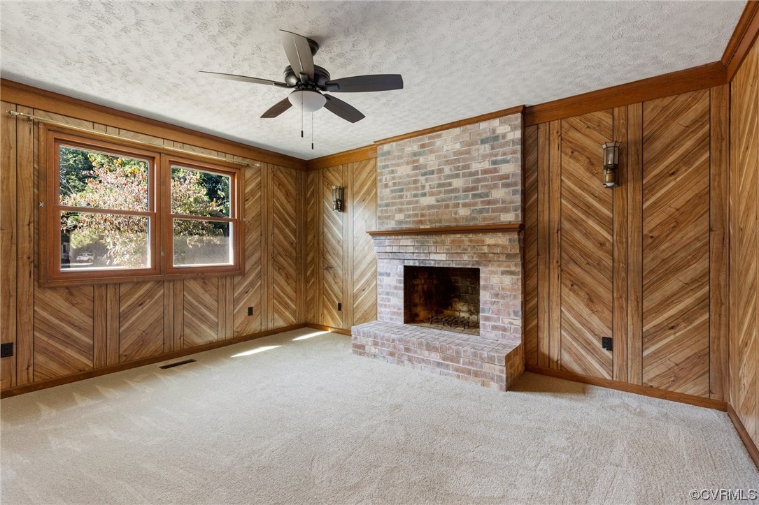 4807 Olgers Road Sutherland, VA 23885 - Photo 15 of 25 a living room with furniture and a fireplace