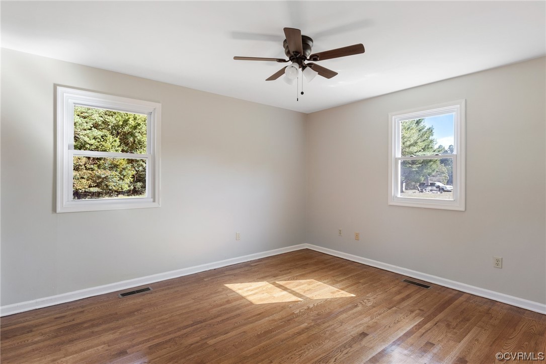 4807 Olgers Road Sutherland, VA 23885 - Photo 20 of 25 a view of empty room with wooden floor and fan