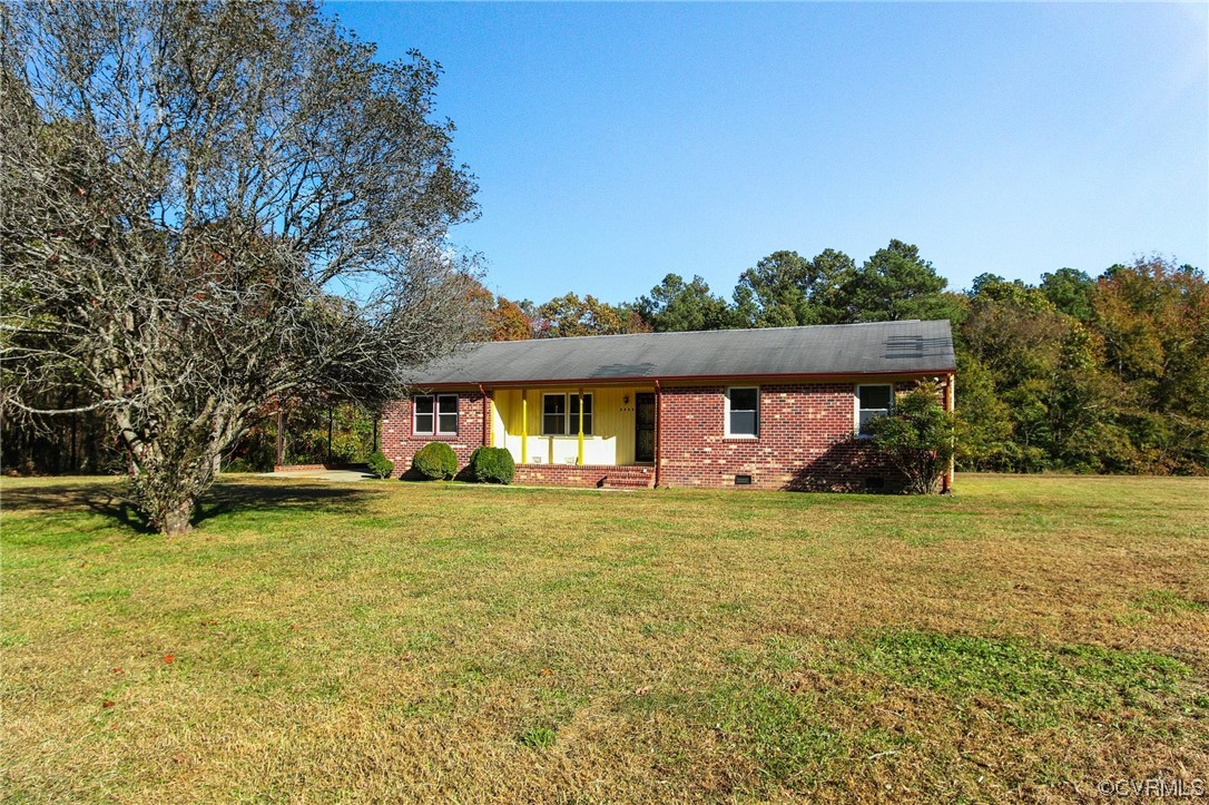 4807 Olgers Road Sutherland, VA 23885 - Photo 3 of 25 front view of a house with a yard