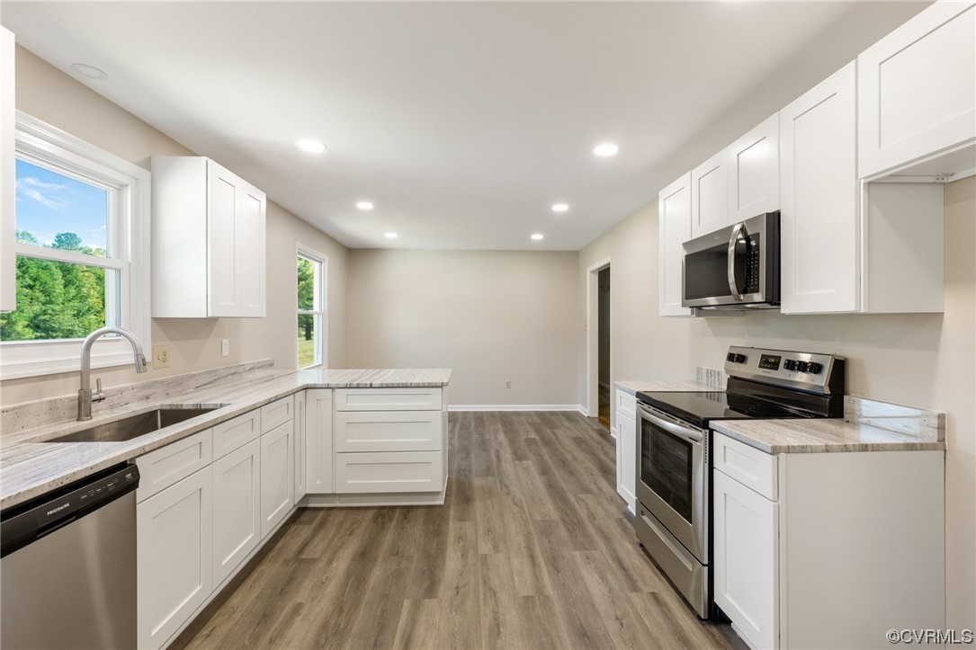 4807 Olgers Road Sutherland, VA 23885 - Photo 10 of 25 a kitchen with a sink stove and microwave