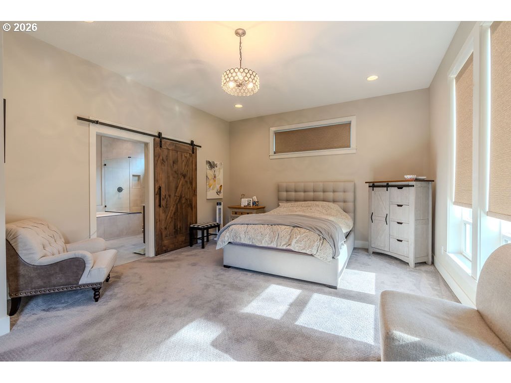 38408 Juniper Street Sandy, OR 97055 - Photo 14 of 47 a spacious bedroom with a bed and a couch