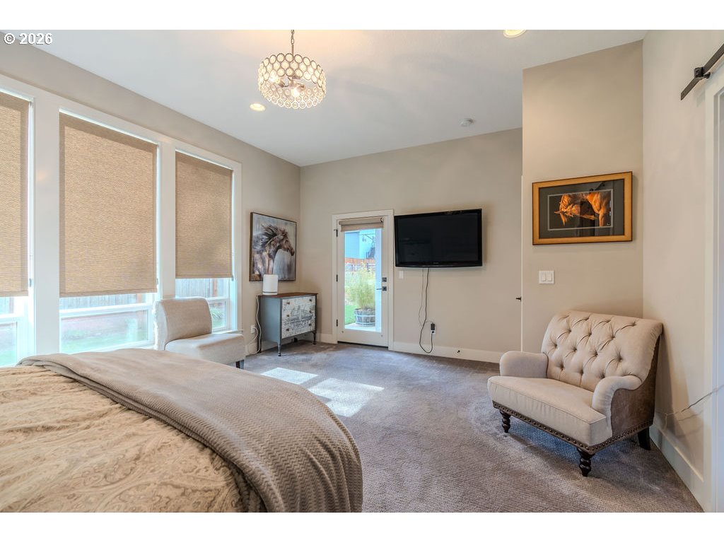 38408 Juniper Street Sandy, OR 97055 - Photo 16 of 47 a bedroom with a bed and a flat screen tv