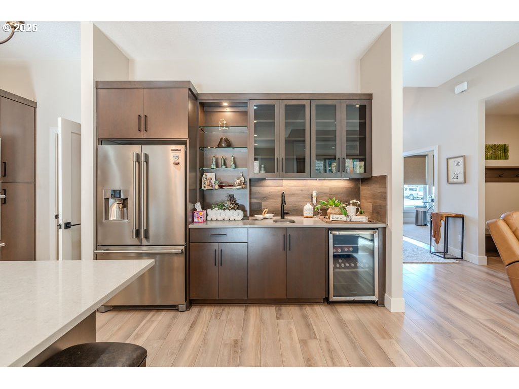 38408 Juniper Street Sandy, OR 97055 - Photo 24 of 47 a kitchen with stainless steel appliances kitchen island granite countertop a refrigerator and a stove top oven