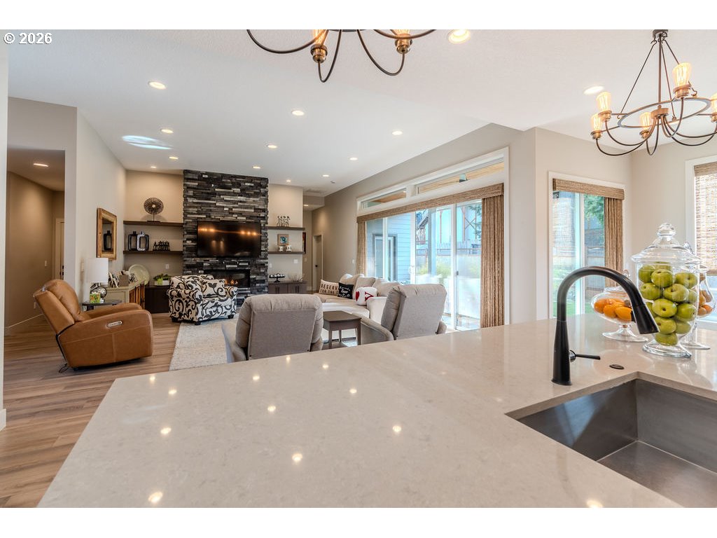 38408 Juniper Street Sandy, OR 97055 - Photo 27 of 47 a living room with furniture a chandelier and a large window