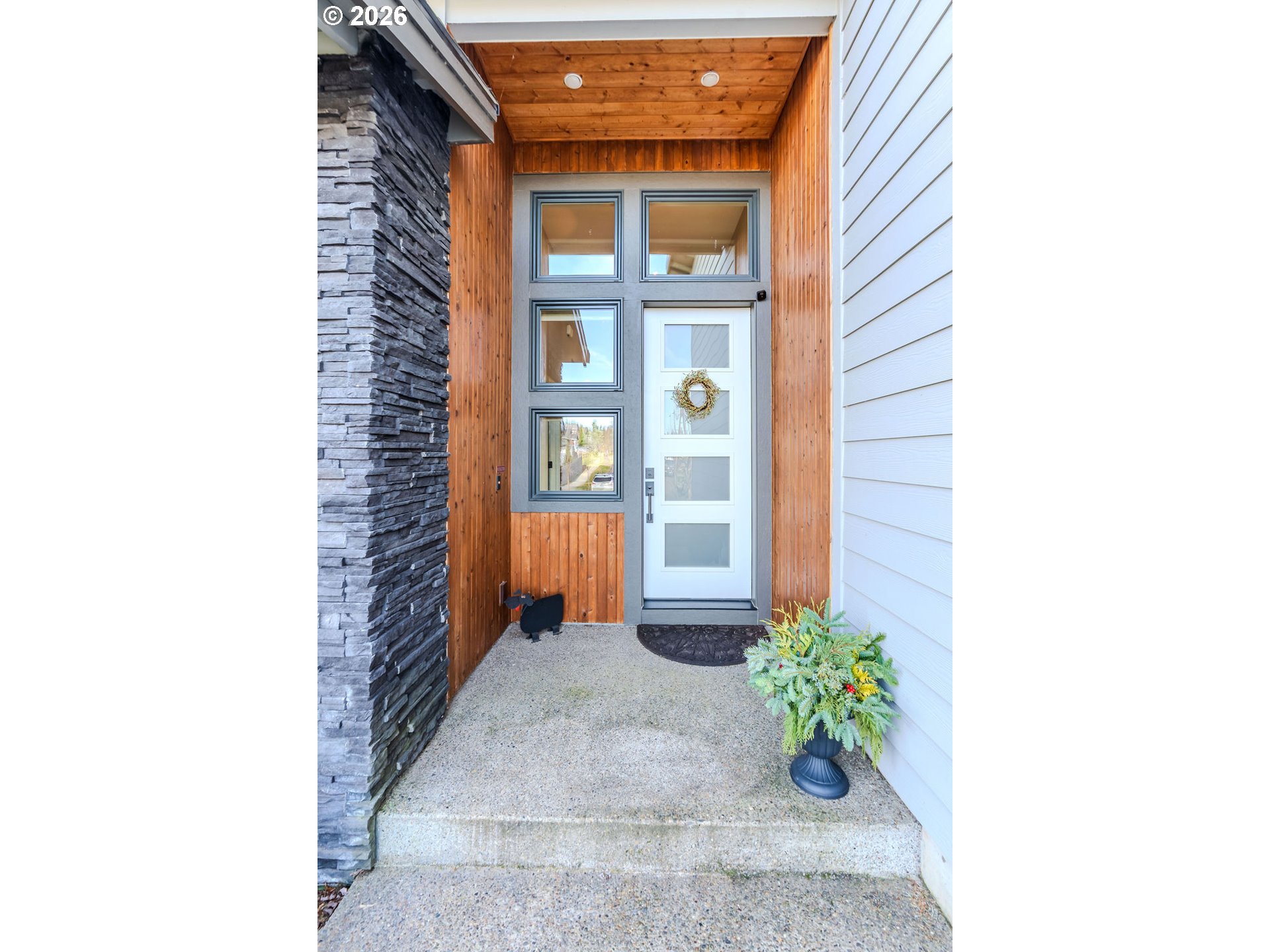 38408 Juniper Street Sandy, OR 97055 - Photo 3 of 47 a room with potted plants in front of door