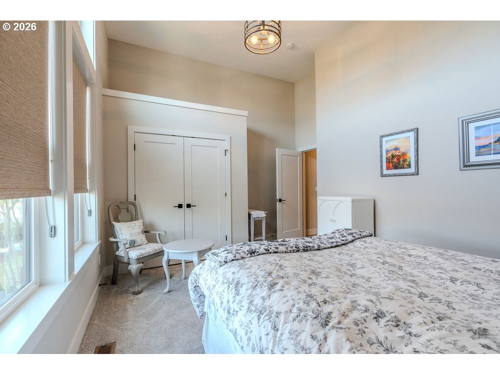 38408 Juniper Street Sandy, OR 97055 - Photo 10 of 47 a bedroom with a bed and a large mirror