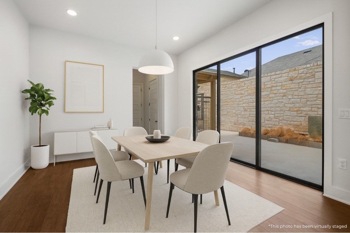 3904 Teaff Street Austin, TX 78723 - Photo 11 of 33 a view of a dining room with furniture window and wooden floor