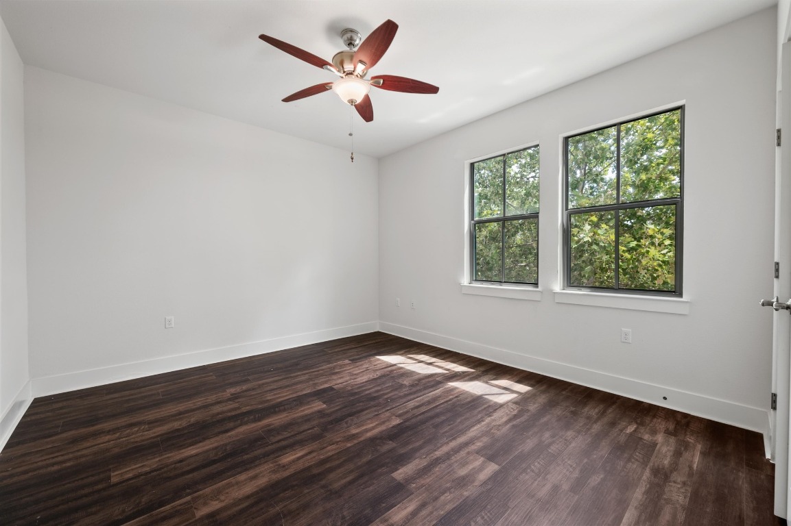 3904 Teaff Street Austin, TX 78723 - Photo 23 of 33 a view of an empty room with wooden floor and a window