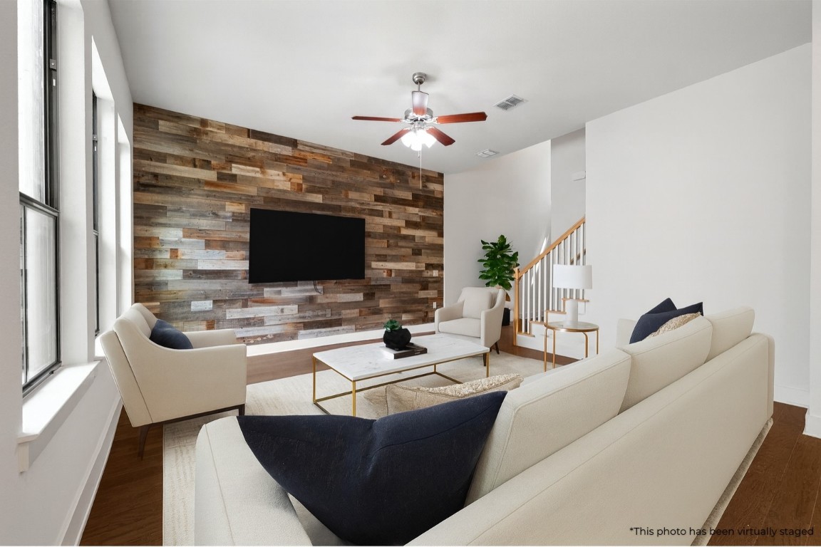 3904 Teaff Street Austin, TX 78723 - Photo 3 of 33 a living room with furniture a flat screen tv and a fireplace