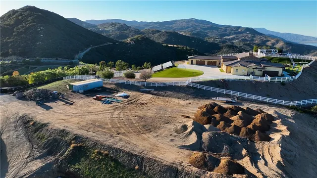 a view of a swimming pool with a yard