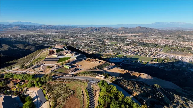 an aerial view of a house with a ocean view
