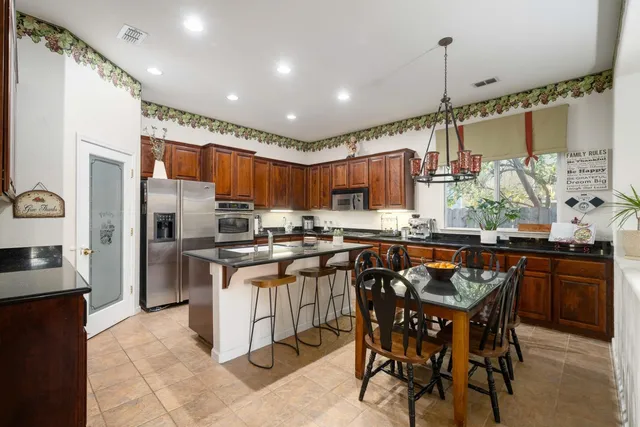 a kitchen with a sink a counter and cabinets