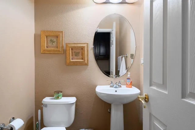 a bathroom with a sink a vanity and a mirror