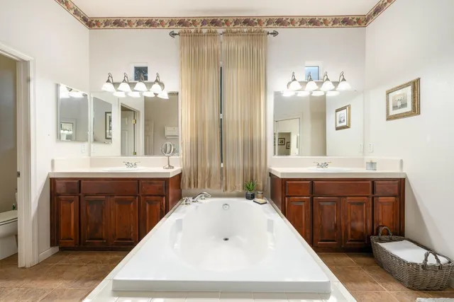 a living room with furniture a pool table and a window
