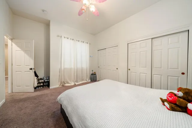a bathroom with a sink a toilet a mirror and shower