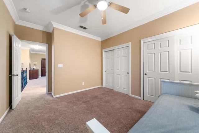 a view of a backyard with swimming pool and sitting area