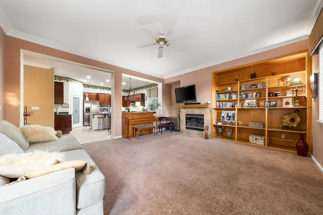 a view of swimming pool with outdoor seating and plants