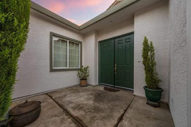 a swimming pool with outdoor seating and yard