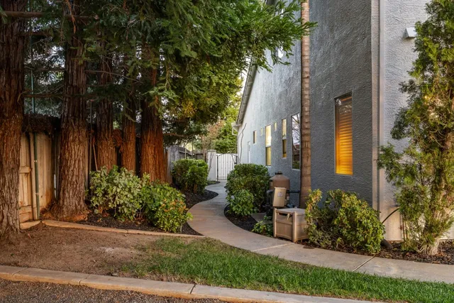 a view of a patio with a table and chairs