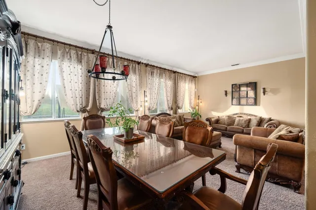 a kitchen with kitchen island granite countertop a stove cabinets and refrigerator