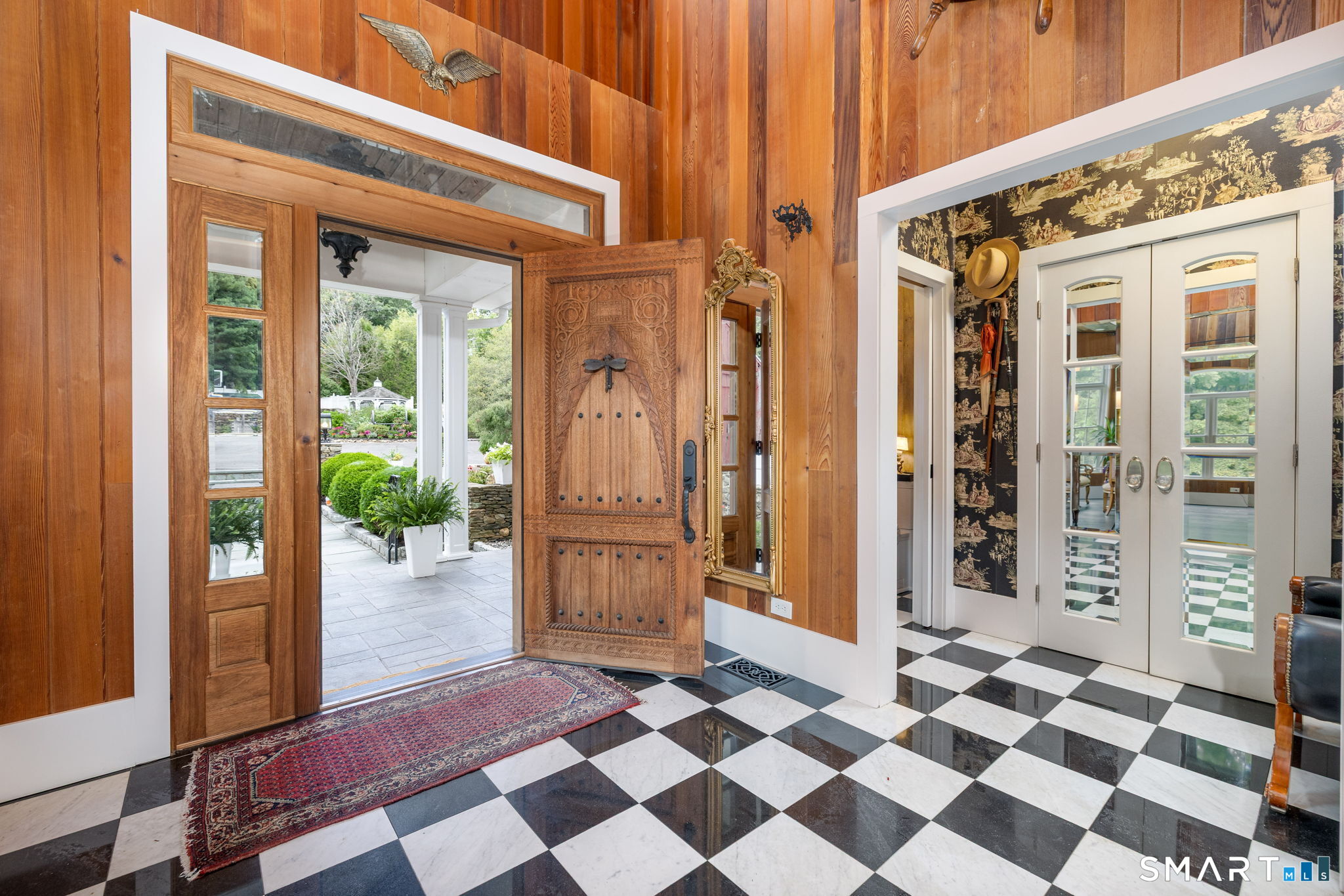 695 Spindle Hill Road Wolcott, CT 06716 - Photo 7 of 40 Black & white marble checkerboard floor with mirrored French doors.