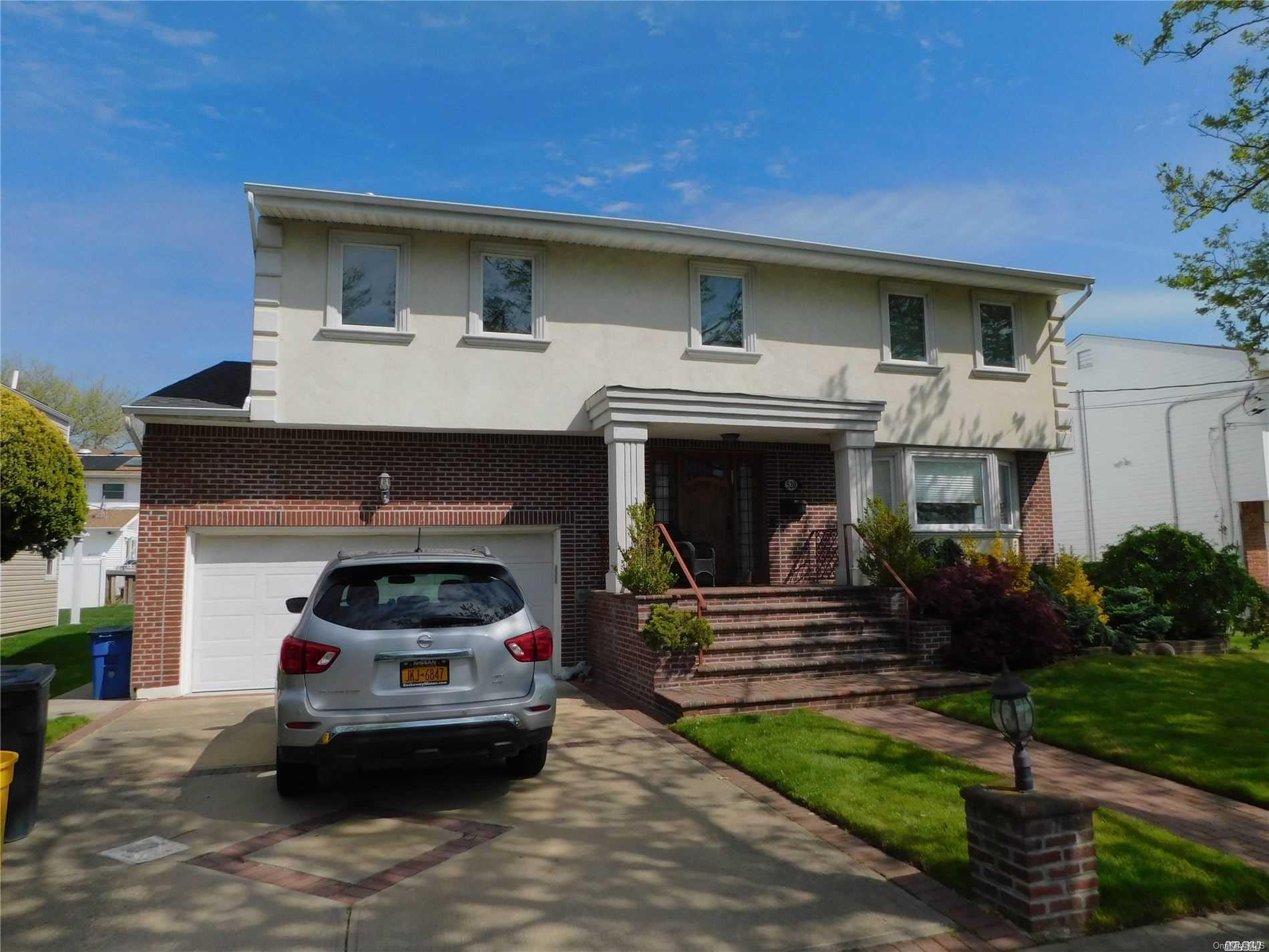 a car parked in front of a house