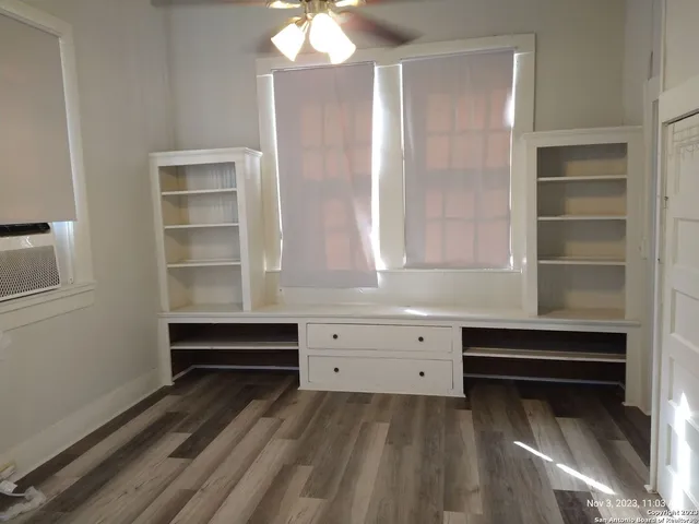 a view of room with cabinet and mirror