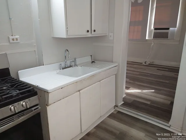 a utility room with cabinets