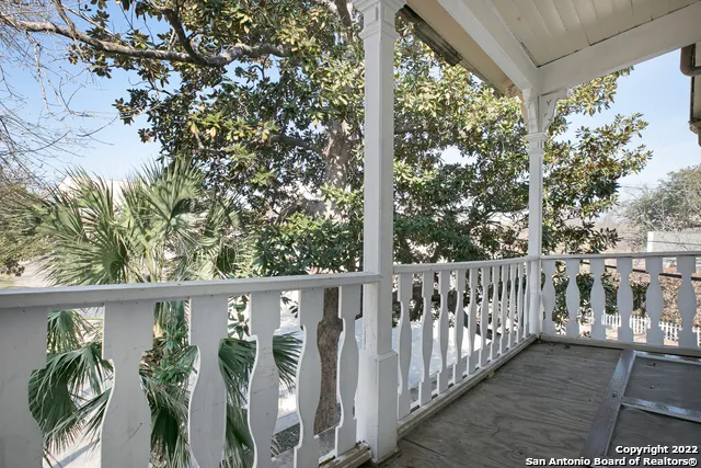 a view of a street with a tree