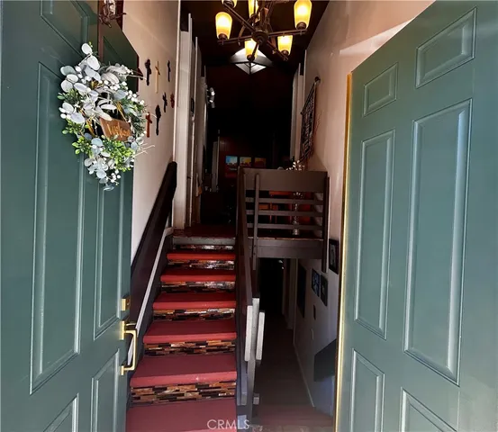 a view of stairs and flowers in a room