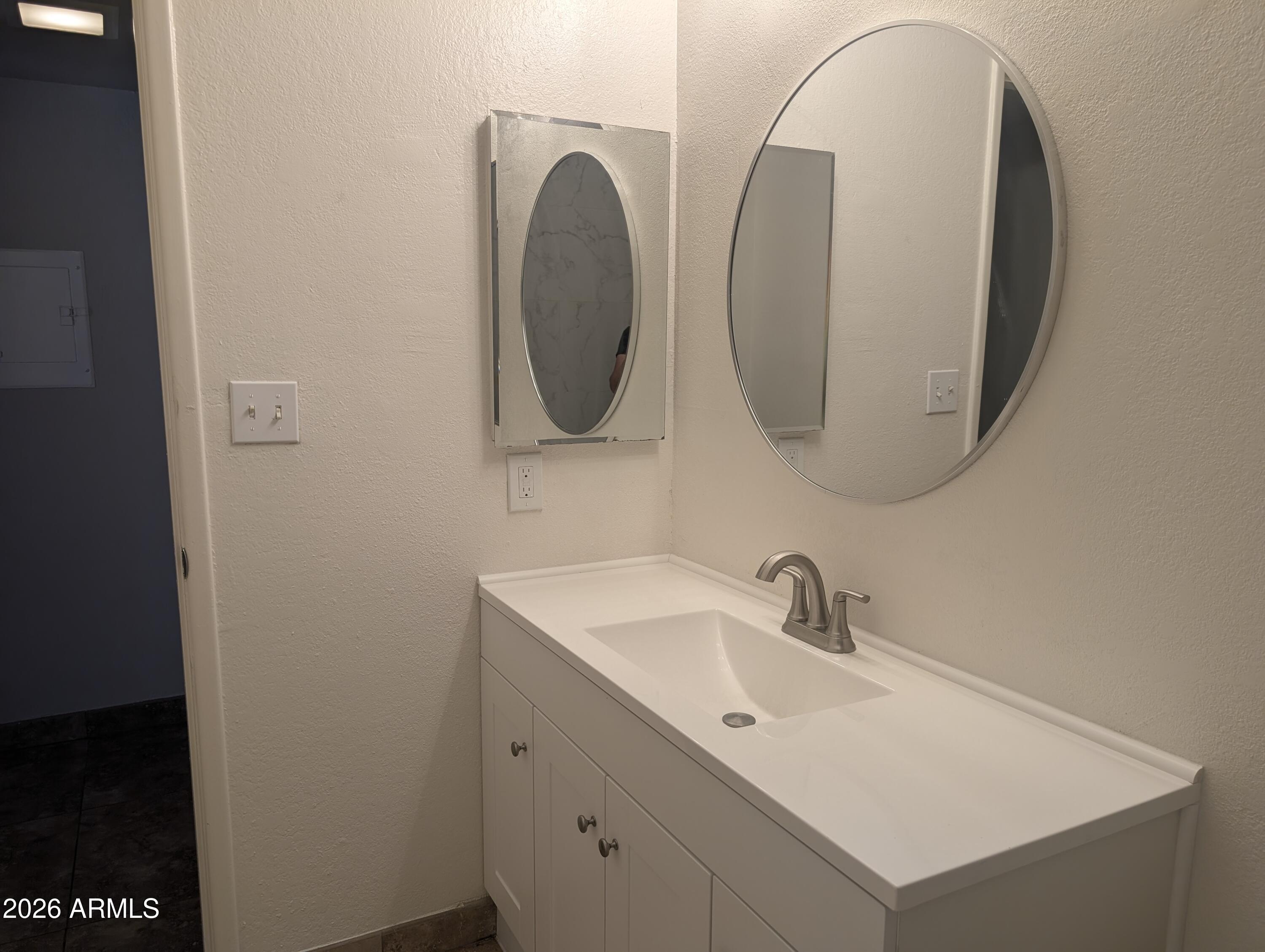 540 North May, Unit 1101 Mesa, AZ 85201 - Photo 14 of 15 Counter space and bathroom lighting