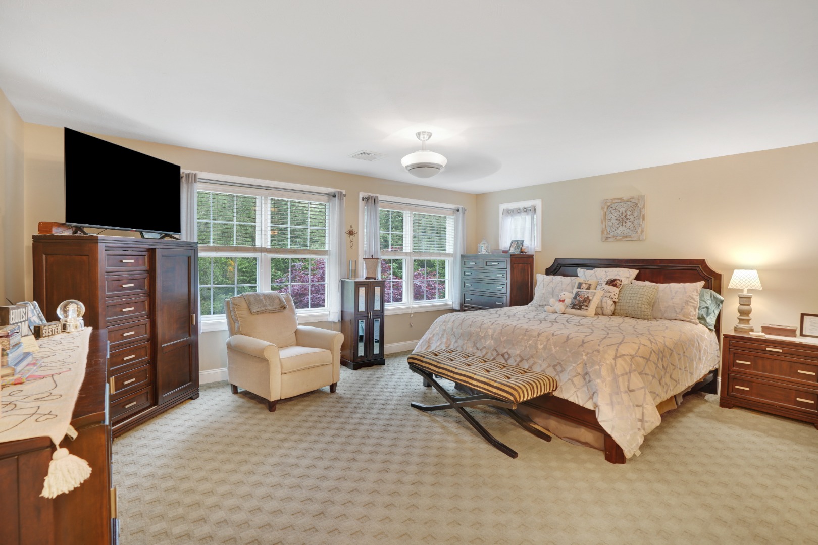8 Fresh Pond Road Oak Bluffs, MA 02557 - Photo 11 of 36 a spacious bedroom with a bed and a flat screen television
