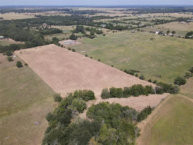 an aerial view of ocean with residential house and lake view