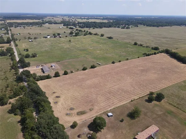 an aerial view of a houses with ocean view