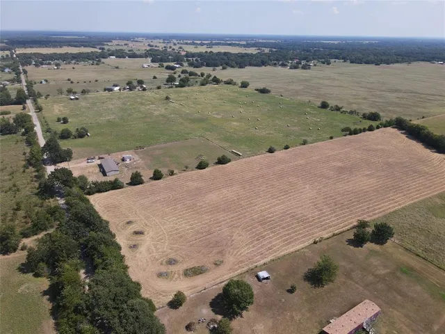 an aerial view of a houses with ocean view