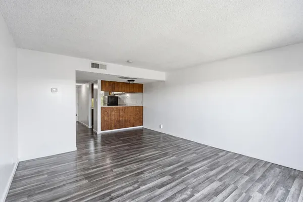 a view of entryway and gallery with wooden floor