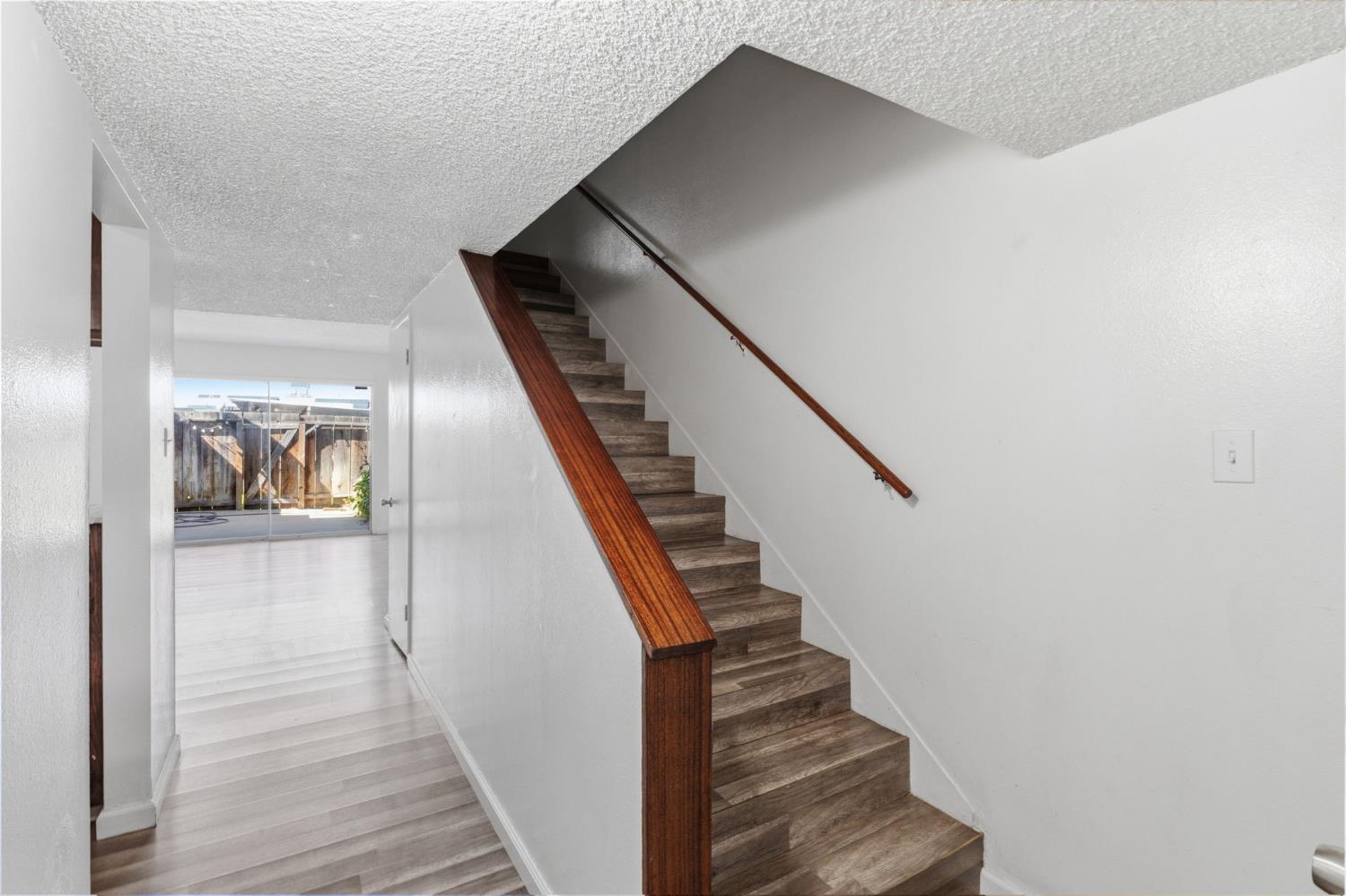 175 South 19th Avenue Lemoore, CA 93245 - Photo 14 of 42 a view of entryway and gallery with wooden floor