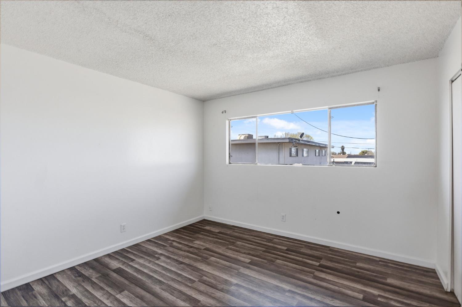 175 South 19th Avenue Lemoore, CA 93245 - Photo 16 of 42 a view of a room with wooden floor
