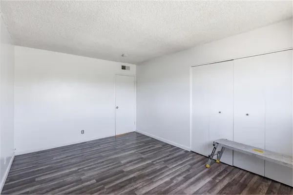 a bathroom with a sink and mirror with toilet