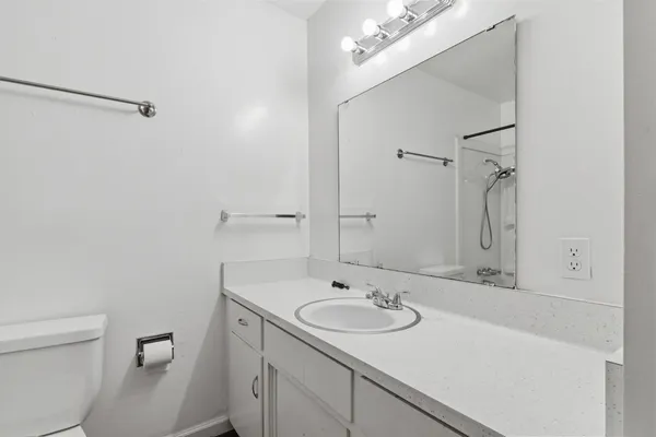 a bathroom with a bath tub with a shower