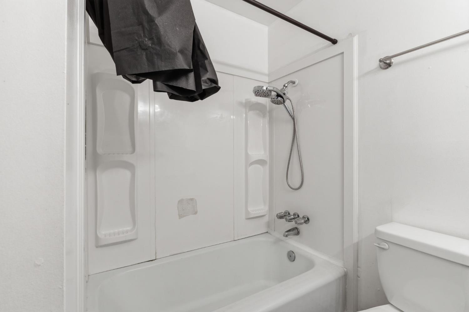 175 South 19th Avenue Lemoore, CA 93245 - Photo 21 of 42 a bathroom with a bath tub with a shower