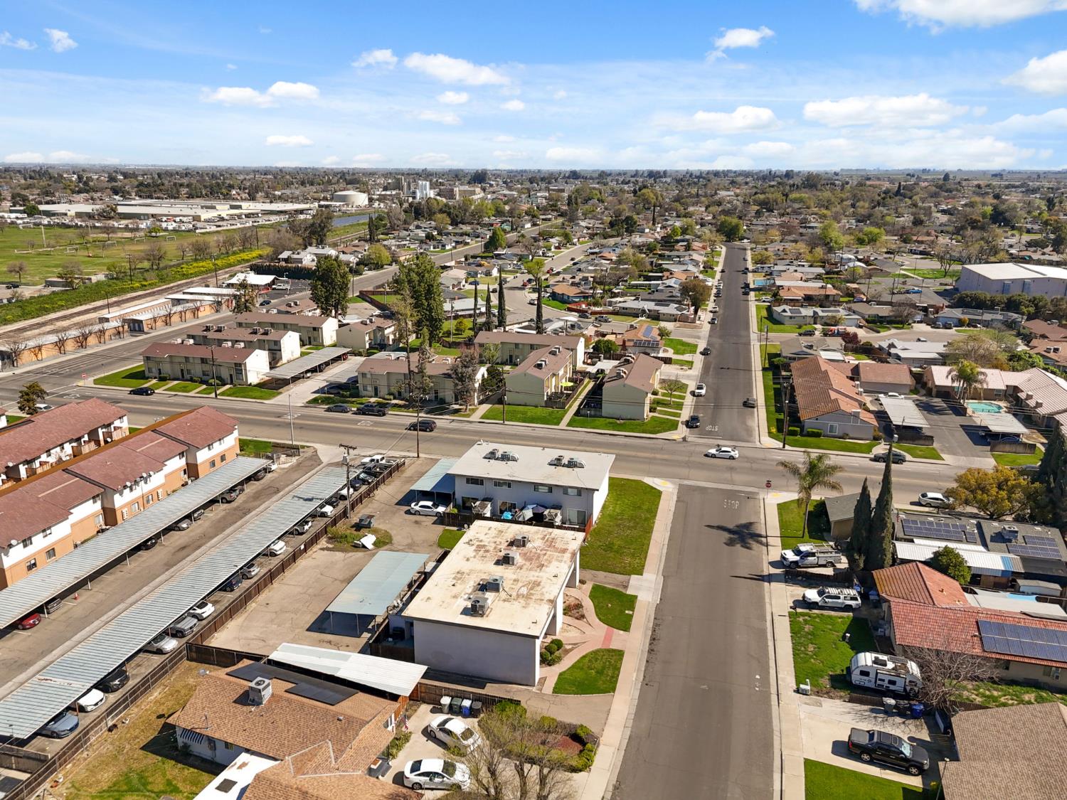 175 South 19th Avenue Lemoore, CA 93245 - Photo 40 of 42 an aerial view of a city with lots of residential buildings and ocean view in back
