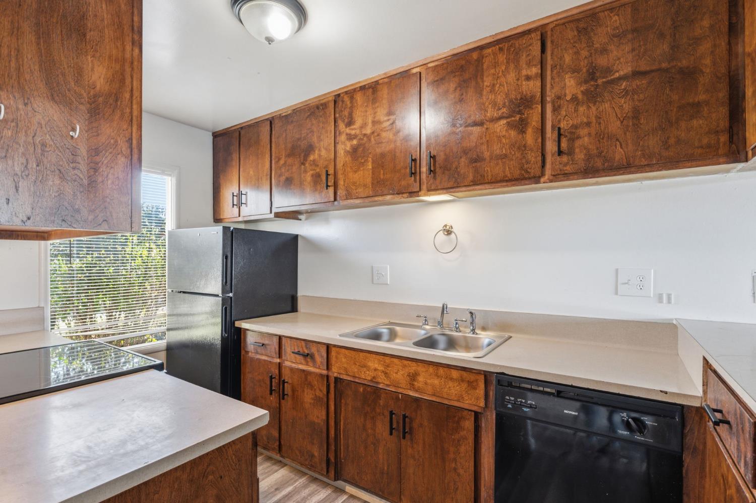 175 South 19th Avenue Lemoore, CA 93245 - Photo 7 of 42 a kitchen with stainless steel appliances granite countertop a sink stove and refrigerator