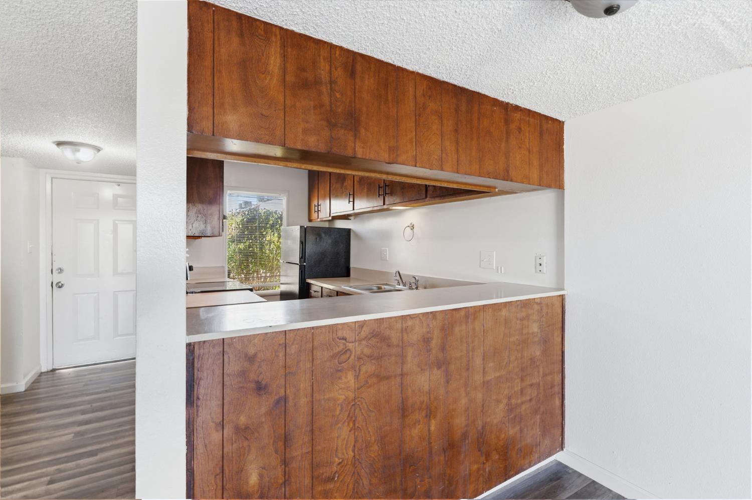 175 South 19th Avenue Lemoore, CA 93245 - Photo 10 of 42 a kitchen with a sink and cabinets