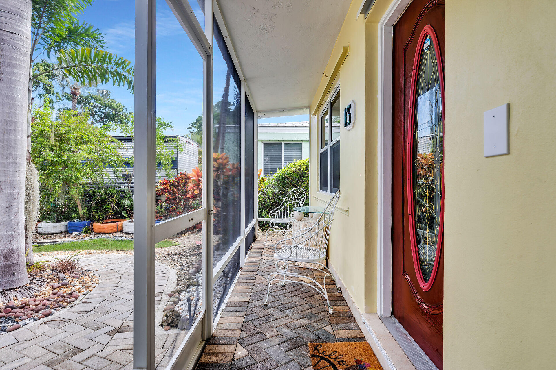 13 Bass Avenue Key Largo, FL 33037 - Photo 5 of 43 a view of a entryway door front of house